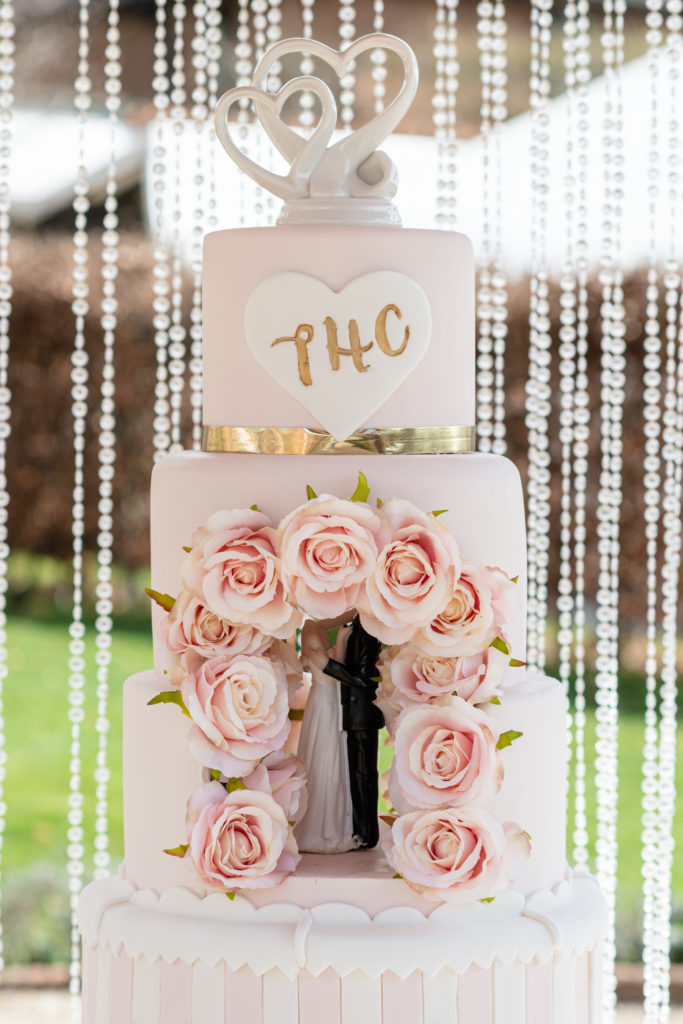 Regency-style wedding cake with romantic florals for a Bridgerton inspired wedding shoot