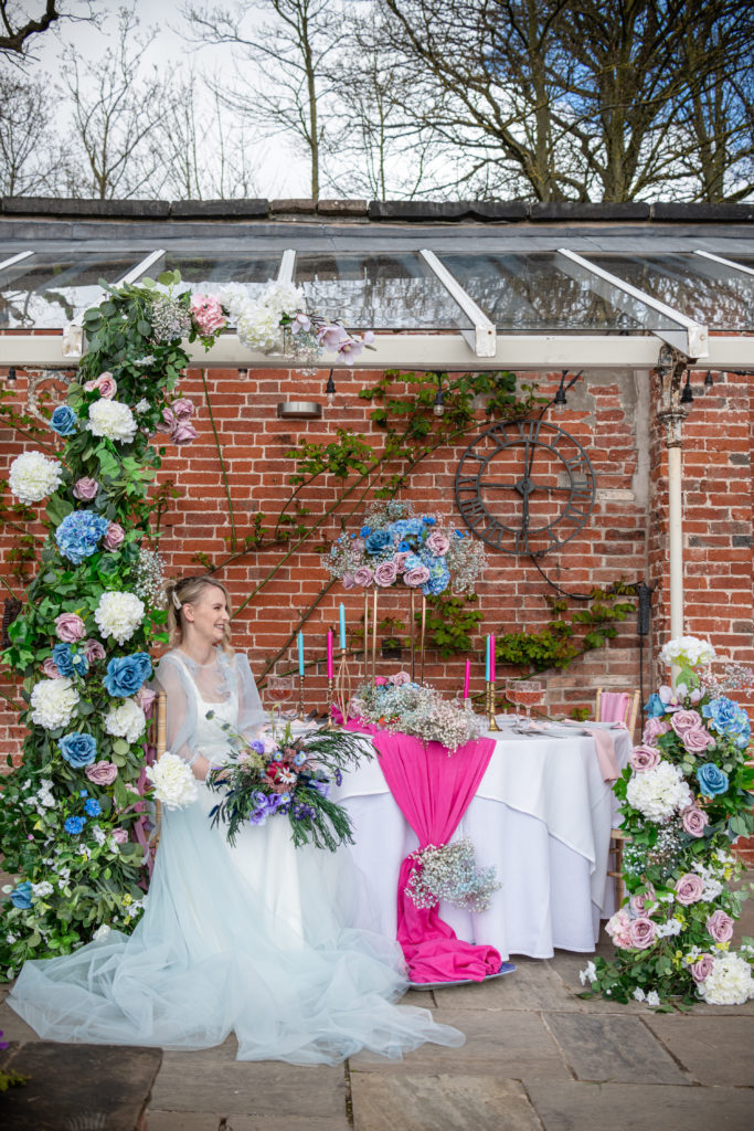 Pastel pink and blue wedding flowers styled for a Bridgerton themed wedding