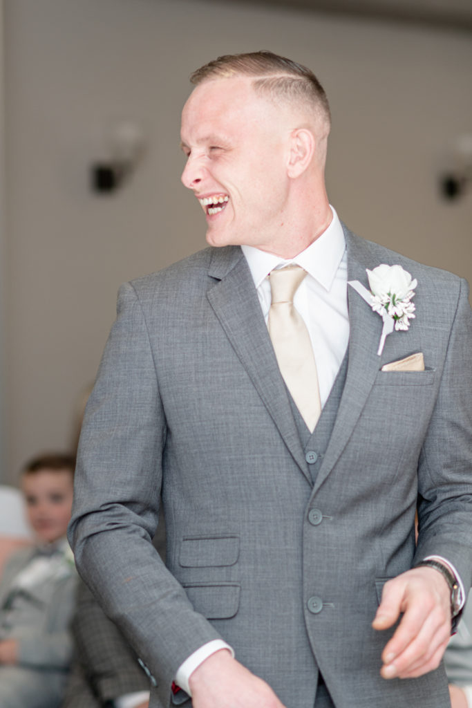 Groom Perry standing in anticipation moments before the ceremony