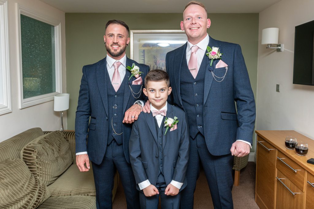 The groomsmen sharing a laugh while getting ready