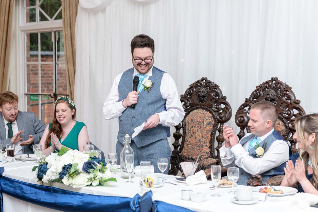 Natural wedding photography during speeches and laughter