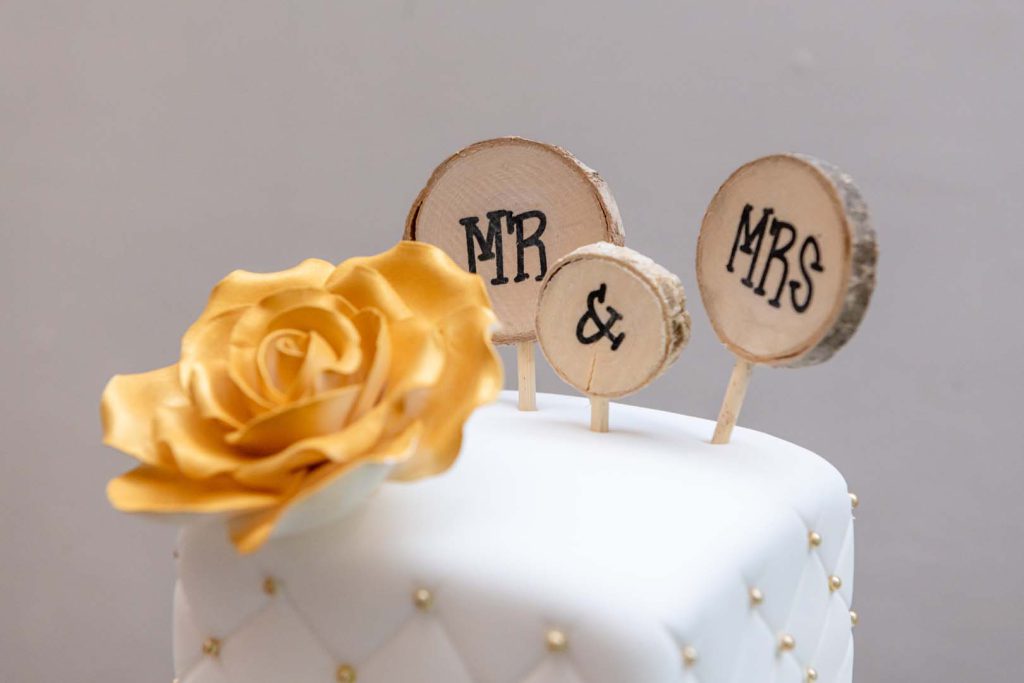 Spring-themed wedding cake with floral accents