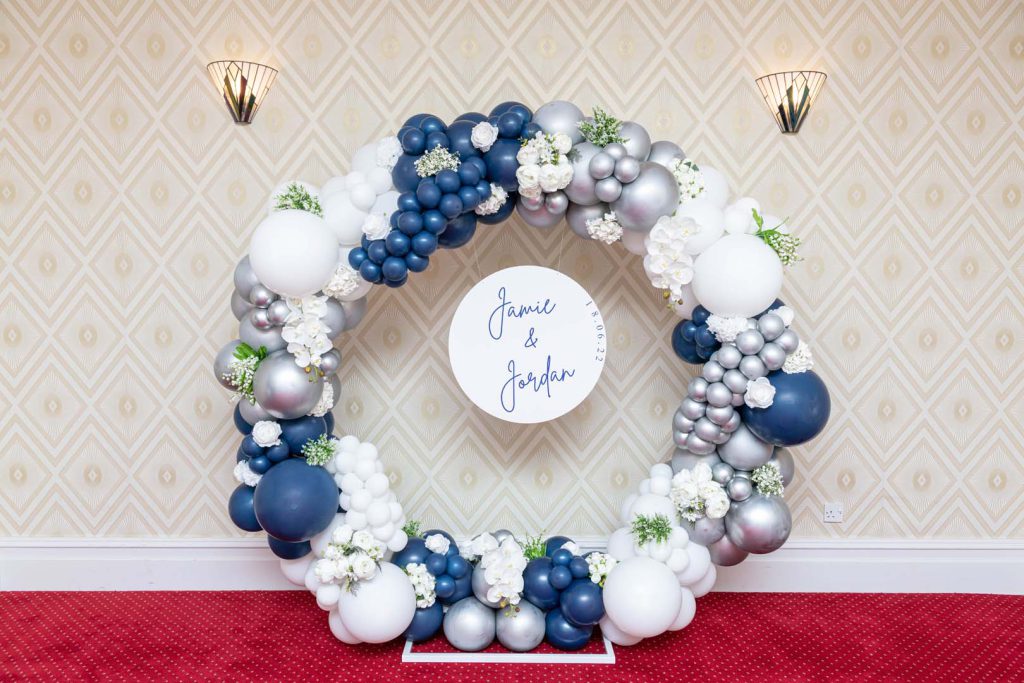 Balloon arch group photo by Bubble Luxe Balloons