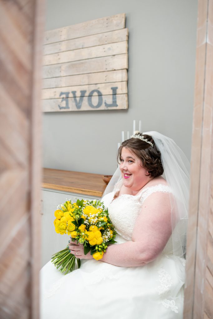 Bride Sarah smiling during morning preparations