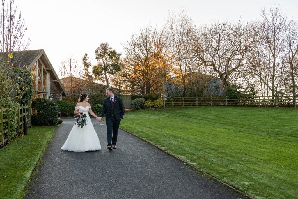 Natural wedding photography at Mythe Barn – newlyweds at their December wedding