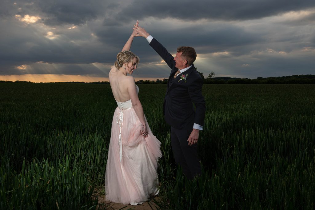 motional natural wedding photo capturing a meaningful moment between newlyweds