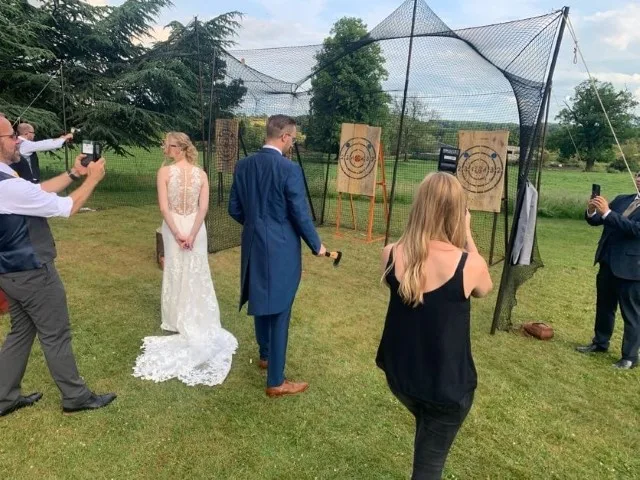 Candid behind-the-scenes moment of LB Photography capturing a wedding