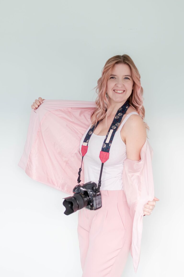 Leanne from LB Photography smiling in her pink jacket - natural wedding photographer