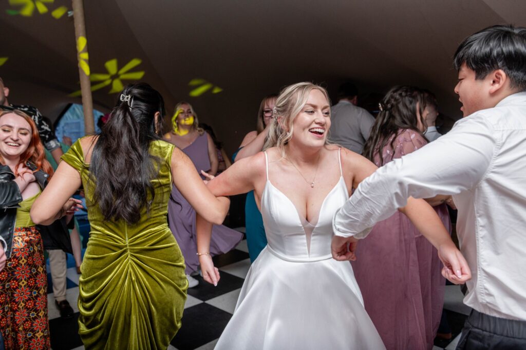First dance under twinkle lights captured as part of the Stress-Free Wedding Timeline