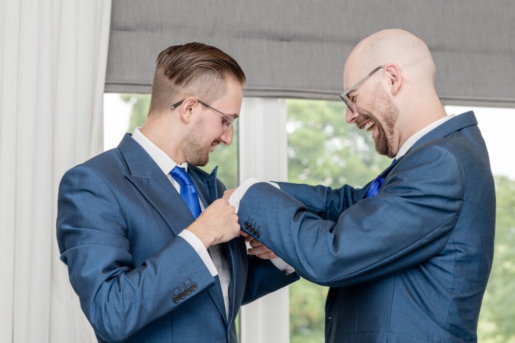 Groom getting ready with best man – candid moment during morning prep