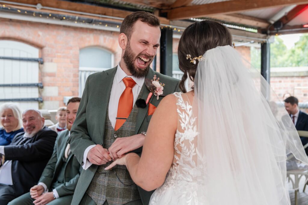 Relaxed ceremony moment photographed by a natural wedding photographer in Nuneaton