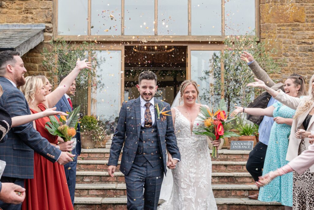 Confetti moment captured by a natural wedding photographer in Nuneaton
