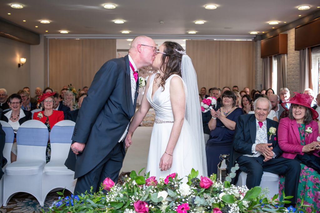 Just married first kiss shot at Charlecote Pheasant Hotel