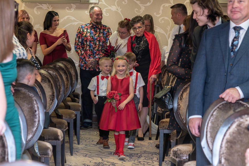 Flower girl smiling during wedding celebration