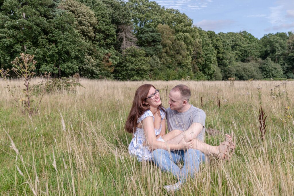 Engaged couple laughing during couples shoot – natural and fun couples portfolio photography